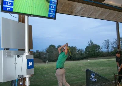 person swinging at the driving range